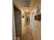 Hallway with carpet and neutrally painted walls and white doors leading to other areas of the home at 2254 E University Dr # 4, Mesa, AZ 85213
