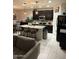 Inviting kitchen with island seating, stainless steel appliances, and seamless flow to the living area at 2254 E University Dr # 4, Mesa, AZ 85213