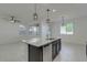 Bright, open kitchen area with a granite-topped island and stainless steel dishwasher and sink at 2254 E University Dr # 4, Mesa, AZ 85213