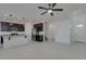 Open-concept living area with tile floors, seamlessly connecting the living room and kitchen at 2254 E University Dr # 4, Mesa, AZ 85213