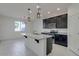 Well-lit kitchen featuring stainless steel appliances, granite countertops, and a functional kitchen island at 2254 E University Dr # 4, Mesa, AZ 85213