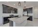 Modern kitchen features dark cabinets, stainless steel appliances, and granite countertops at 2254 E University Dr # 4, Mesa, AZ 85213