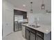 Modern kitchen featuring stainless steel appliances and a stylish island with granite countertops at 2254 E University Dr # 4, Mesa, AZ 85213