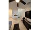 Bright living room featuring tile flooring, high ceilings, and a traditional front door at 2254 E University Dr # 4, Mesa, AZ 85213