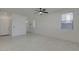 Bright living room features tile floors, neutral walls, and multiple windows at 2254 E University Dr # 4, Mesa, AZ 85213