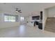 Open-concept living area with tile floors, seamlessly connecting the living room and kitchen at 2254 E University Dr # 4, Mesa, AZ 85213