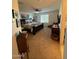 Spacious main bedroom with a ceiling fan and a comfortable bed and seating space at 2254 E University Dr # 4, Mesa, AZ 85213