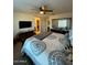Tranquil main bedroom with a ceiling fan, ensuite bathroom, and view of the closet at 2254 E University Dr # 4, Mesa, AZ 85213