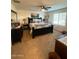Main bedroom featuring a large bed, dark wood furniture, and soft, neutral decor at 2254 E University Dr # 4, Mesa, AZ 85213