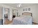 Inviting bedroom featuring soft lighting, comfortable bedding, and a mirrored closet at 2333 E Southern Ave # 2016, Tempe, AZ 85282