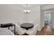 Bright dining area with a modern chandelier and views into the connected bedroom at 2333 E Southern Ave # 2016, Tempe, AZ 85282