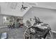 A modern gym with ceiling fan, various exercise machines, and windows with natural light at 2333 E Southern Ave # 2016, Tempe, AZ 85282