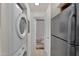Hallway laundry room with refrigerator at 2333 E Southern Ave # 2016, Tempe, AZ 85282