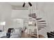 Modern living room with a spiral staircase, an open floor plan, and views to the kitchen and dining areas at 2333 E Southern Ave # 2016, Tempe, AZ 85282