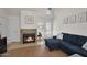 Inviting living room featuring a stone fireplace, comfortable seating, and bright natural light at 2333 E Southern Ave # 2016, Tempe, AZ 85282