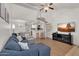 Bright living room featuring a spiral staircase, comfortable seating, and modern entertainment setup at 2333 E Southern Ave # 2016, Tempe, AZ 85282