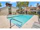 Exterior community pool featuring lounge chairs, blue tiling, and surrounding multi-story condo buildings at 2333 E Southern Ave # 2016, Tempe, AZ 85282