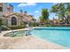 Community pool and hot tub with lounge chairs and condo buildings in background at 2333 E Southern Ave # 2016, Tempe, AZ 85282