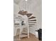 Unique spiral staircase with carpeted steps and a white metal railing, adding architectural interest to the home at 2333 E Southern Ave # 2016, Tempe, AZ 85282