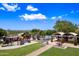 Beautiful aerial view of the community park, highlighting the playground, picnic area and desert landscape under a bright sky at 2638 W Sat Nam Way, Phoenix, AZ 85086
