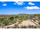 Scenic aerial view of the community park, featuring a sand volleyball court, picnic pavilions, playground and lush desert landscape at 2638 W Sat Nam Way, Phoenix, AZ 85086