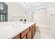 Elegant bathroom featuring double sinks, vanity lights, large mirror, and tile flooring at 2638 W Sat Nam Way, Phoenix, AZ 85086