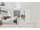 Staged bedroom with ample natural light, stylish furnishings, and a serene atmosphere at 2638 W Sat Nam Way, Phoenix, AZ 85086