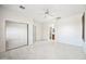 Spacious bedroom with mirrored closet doors and ensuite bathroom at 2638 W Sat Nam Way, Phoenix, AZ 85086