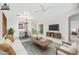Staged living room with open floor plan, stylish furnishings, and a cozy ambiance for relaxation and entertainment at 2638 W Sat Nam Way, Phoenix, AZ 85086