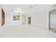 Spacious living room with tile flooring and natural light, offering a blank canvas for personalization at 2638 W Sat Nam Way, Phoenix, AZ 85086