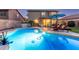 Backyard featuring a sparkling pool, covered patio, lounge chairs and well-manicured landscaping at 3031 S Cortland --, Mesa, AZ 85212