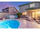 Backyard featuring a sparkling pool, covered patio, and lush desert landscaping at 3031 S Cortland --, Mesa, AZ 85212