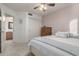 Bright bedroom with soft colors, plush carpet, and a view into the adjacent bathroom at 3031 S Cortland --, Mesa, AZ 85212
