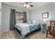 Bedroom featuring a cozy bed with stylish linens and a window providing natural light at 3031 S Cortland --, Mesa, AZ 85212