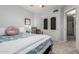 Cozy bedroom with comfortable bed, soft lighting, and sliding closet doors at 3031 S Cortland --, Mesa, AZ 85212