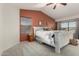 Spacious bedroom with neutral carpet, white bed, and ceiling fan at 3031 S Cortland --, Mesa, AZ 85212