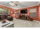 Comfortable living room with large brown couch, media center, and neutral carpet at 3031 S Cortland --, Mesa, AZ 85212
