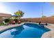 Sparkling swimming pool with spa, surrounded by a paved deck and lush landscaping at 3031 S Cortland --, Mesa, AZ 85212