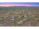 Extensive aerial view captures homes nestled amid a desert landscape, featuring community planning at 30600 N Pima Rd # 61, Scottsdale, AZ 85266