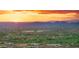 Panoramic aerial view showcases homes bordering a lush golf course set against mountain views at 30600 N Pima Rd # 61, Scottsdale, AZ 85266