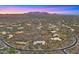 Scenic aerial view displays a well-planned desert community with winding roads and custom homes at 30600 N Pima Rd # 61, Scottsdale, AZ 85266