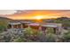Stunning desert home featuring a sparkling pool and beautiful desert landscaping at sunset at 30600 N Pima Rd # 61, Scottsdale, AZ 85266