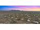 Aerial view of luxury desert homes in a planned community with vibrant sunset colors at 30600 N Pima Rd # 61, Scottsdale, AZ 85266