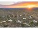 Sunset aerial shot of homes highlighting the vast desert community layout with natural beauty at 30600 N Pima Rd # 61, Scottsdale, AZ 85266