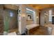 Bright bathroom featuring a soaking tub, stone floors, and an open design at 30600 N Pima Rd # 61, Scottsdale, AZ 85266