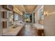 Beautiful bathroom boasting dual sinks, tub, stone floors, ceiling fan, and windows at 30600 N Pima Rd # 61, Scottsdale, AZ 85266