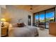 Inviting bedroom showcasing a plush king-sized bed and a large window with a scenic outdoor view at 30600 N Pima Rd # 61, Scottsdale, AZ 85266