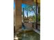 Desert home's courtyard features a water feature and cacti displayed in a decorative bowl at 30600 N Pima Rd # 61, Scottsdale, AZ 85266