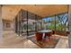 Dining area featuring an oval table, modern chairs, and floor-to-ceiling windows overlooking lush desert landscaping at 30600 N Pima Rd # 61, Scottsdale, AZ 85266