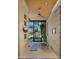 Bright exercise area with exposed brick wall, ceiling fan, and window views at 30600 N Pima Rd # 61, Scottsdale, AZ 85266